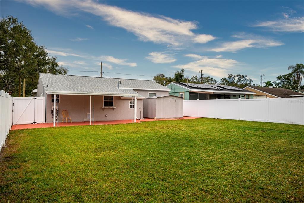 435 3rd Street Northwest Largo, FL 33770 - Photo 26 of 35 a view of a house with a yard and sitting area