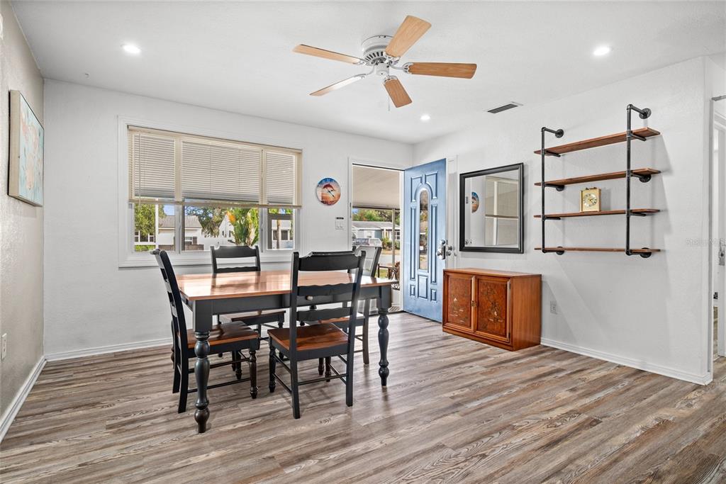 435 3rd Street Northwest Largo, FL 33770 - Photo 6 of 35 a view of a dining room with furniture and wooden floor