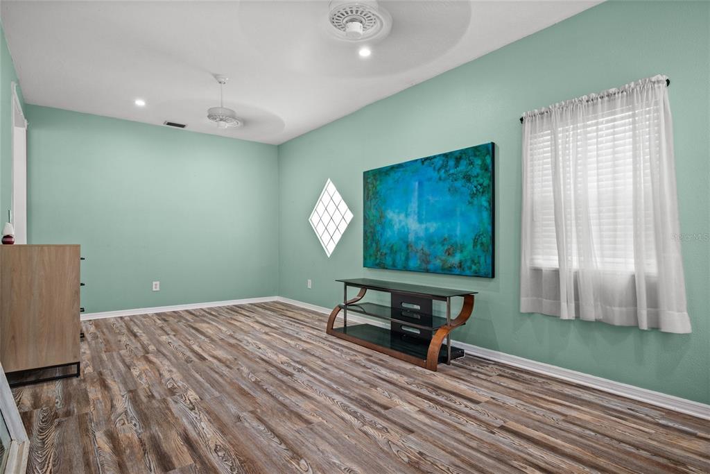 435 3rd Street Northwest Largo, FL 33770 - Photo 9 of 35 a room with furniture and a window