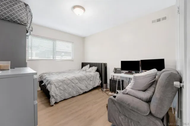 a bedroom with bed and a couch