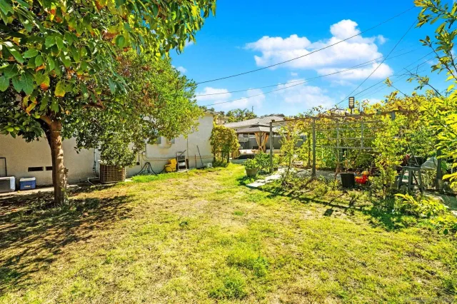 a swimming pool with outdoor seating