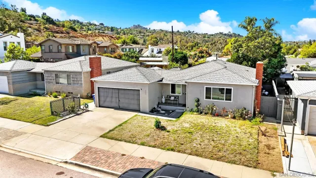 a aerial view of a house with a yard