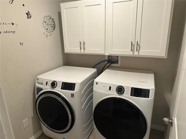a bathroom with a granite countertop sink toilet a shower and a mirror