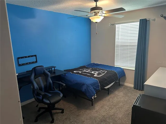 a view of swimming pool with seating space