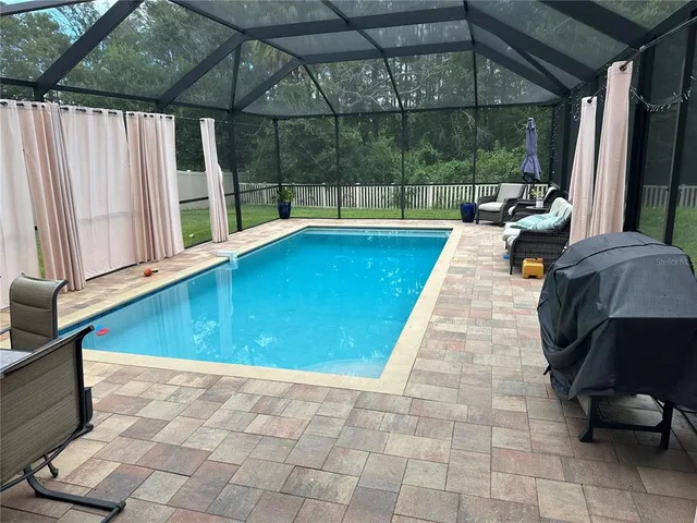 a kitchen with stainless steel appliances granite countertop a sink and a counter space