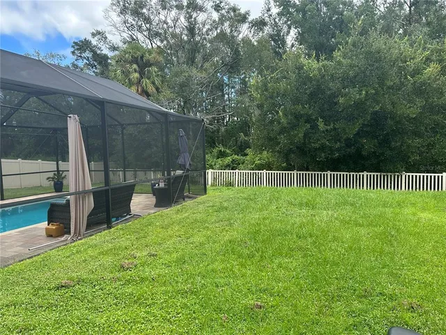 a view of a back yard of the house