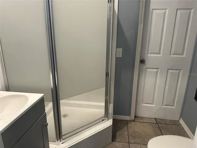 a bathroom with a tub and toilet