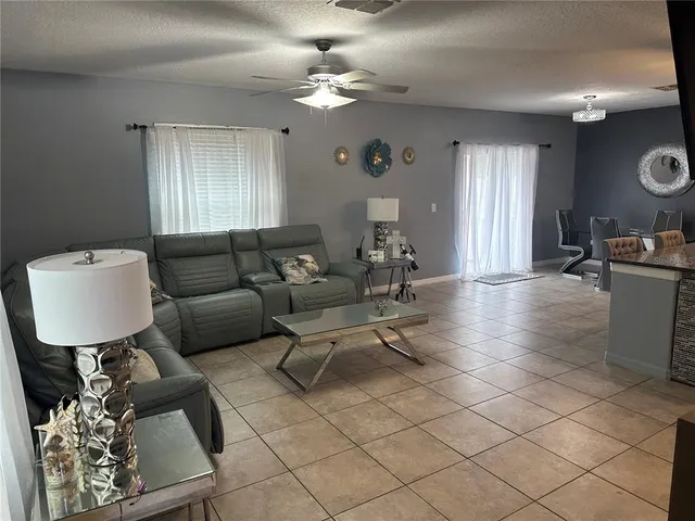 a living room with furniture and a window