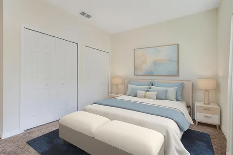 a swimming pool with outdoor seating and yard