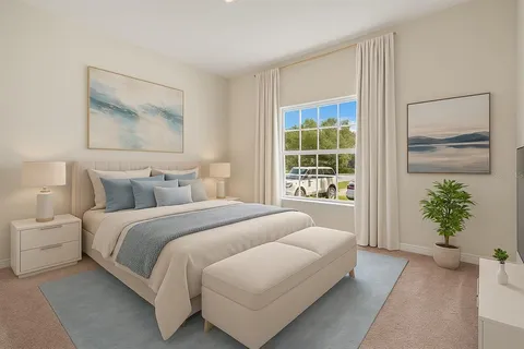 a bedroom with a balcony a bed and a painting on the wall