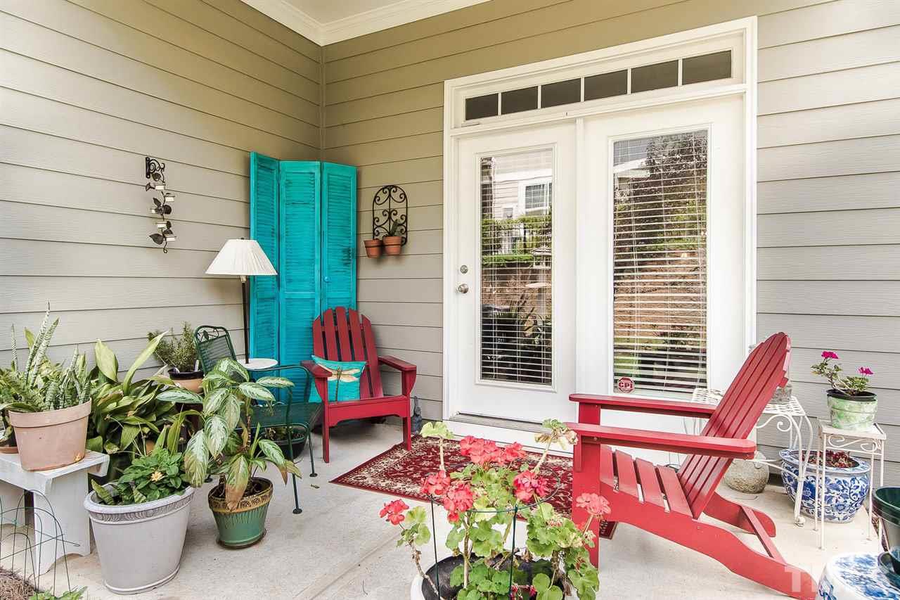 649 Fallon Grove Way Raleigh, NC 27608 - Photo 22 of 22 a front view of a house with outdoor seating