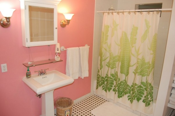 6448 Kalama Road Kapaa, HI 96746 - Photo 23 of 25 a bathroom with a sink and mirror