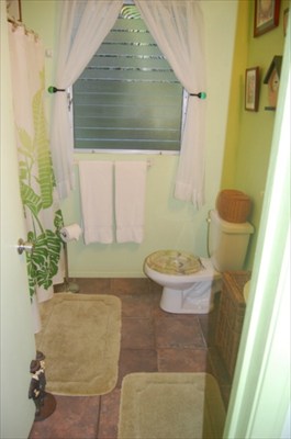 6448 Kalama Road Kapaa, HI 96746 - Photo 3 of 25 a bathroom with a granite countertop sink and a mirror