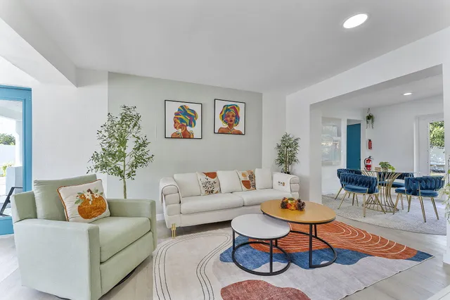 a living room with furniture and a table