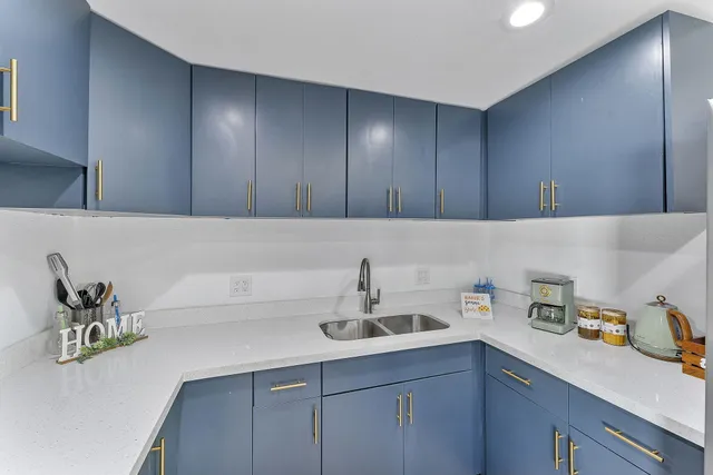 a kitchen with cabinets and sink