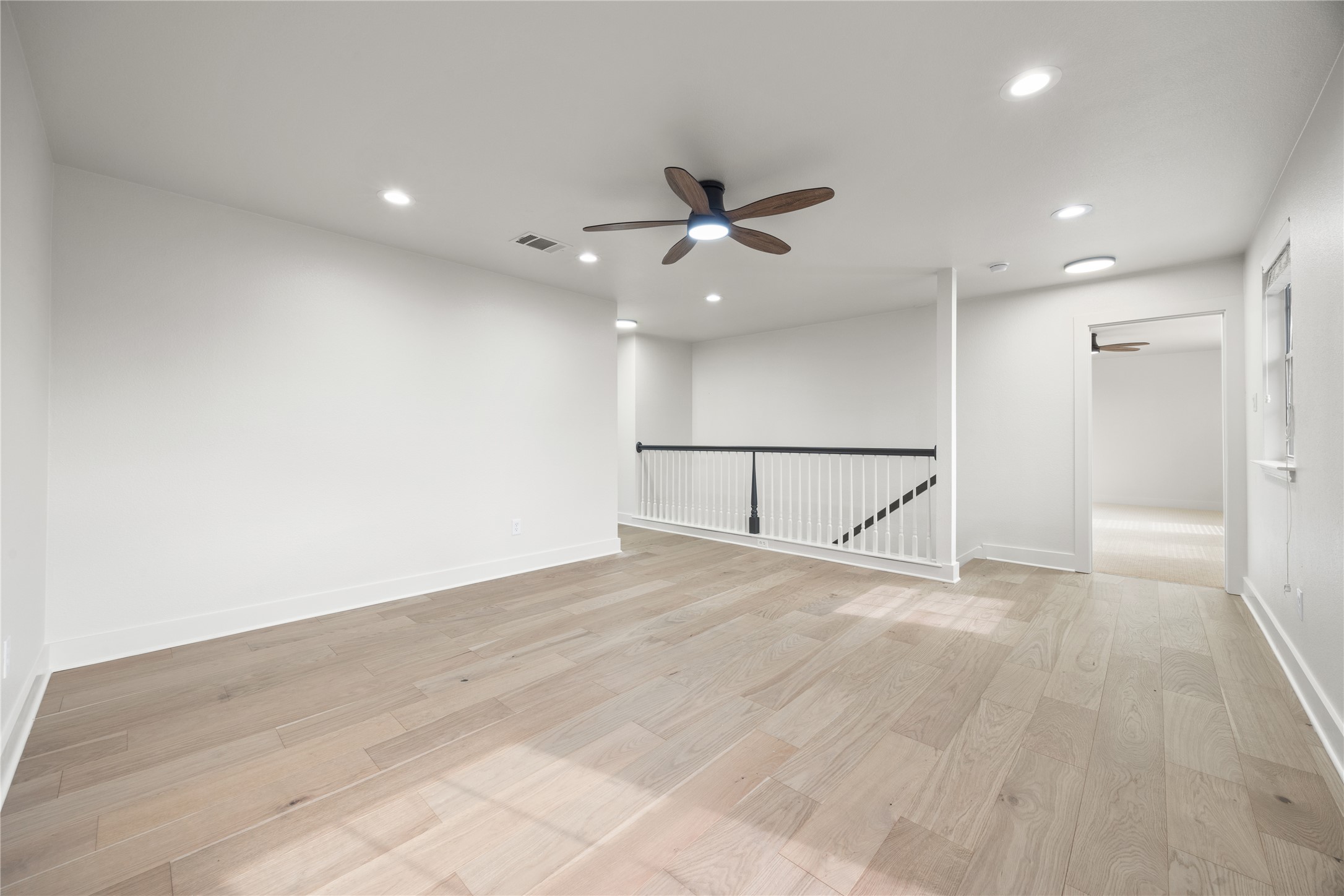 117 Waterloo Drive Kyle, TX 78640 - Photo 12 of 39 an empty room with fan and entryway