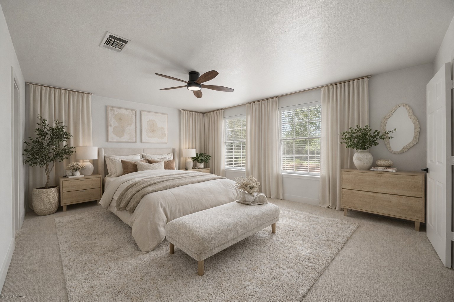 117 Waterloo Drive Kyle, TX 78640 - Photo 14 of 39 a spacious bedroom with a bed a couch and potted plant