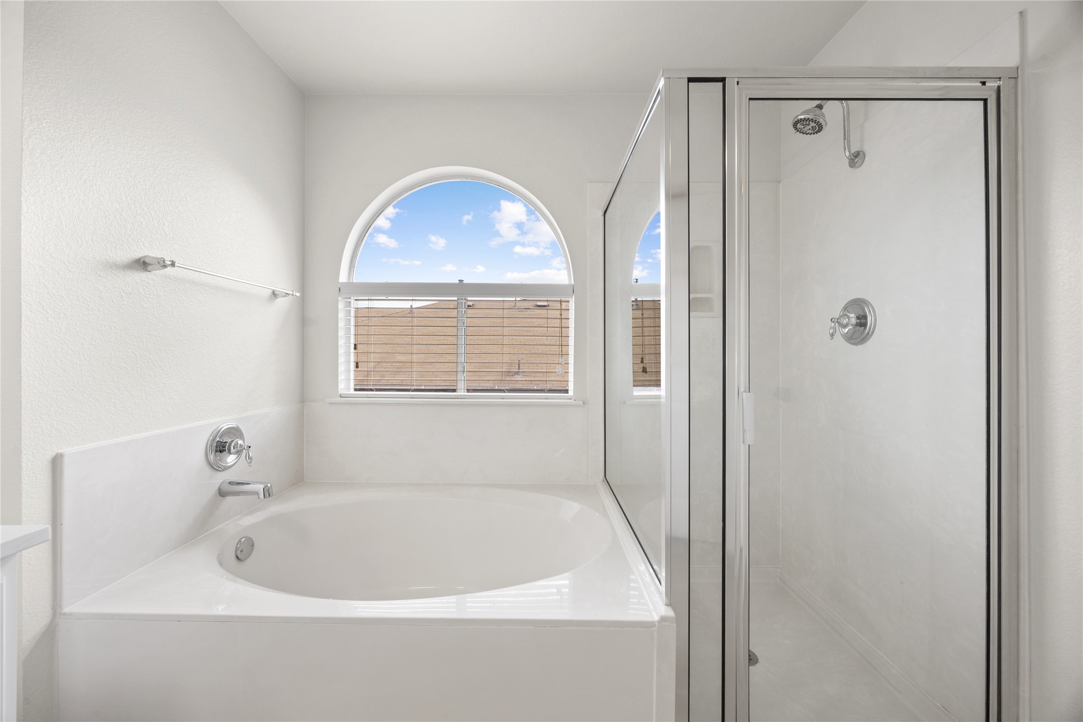 117 Waterloo Drive Kyle, TX 78640 - Photo 18 of 39 a white bath tub sitting next to a window
