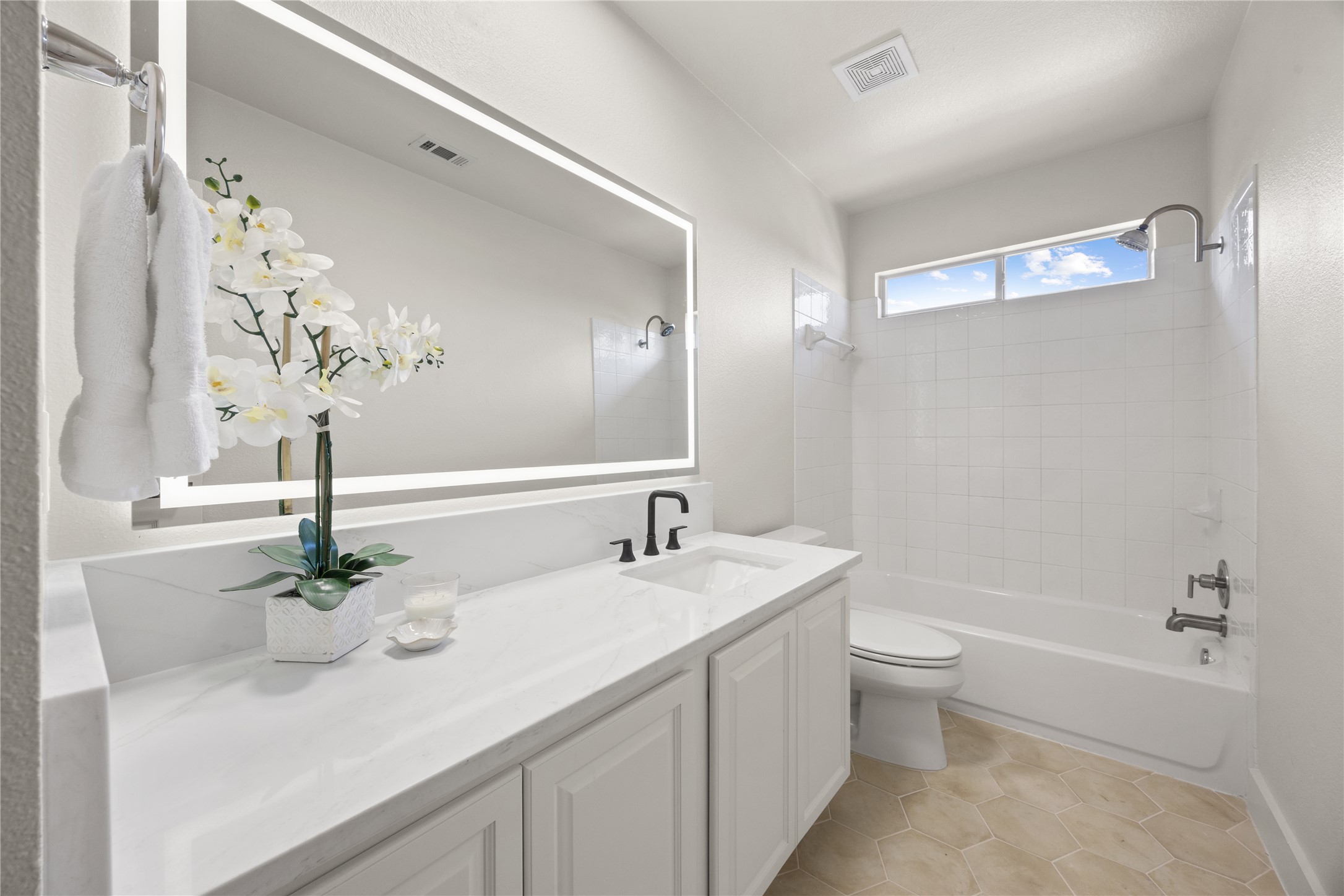 117 Waterloo Drive Kyle, TX 78640 - Photo 21 of 39 a bathroom with a double vanity sink a toilet and a mirror