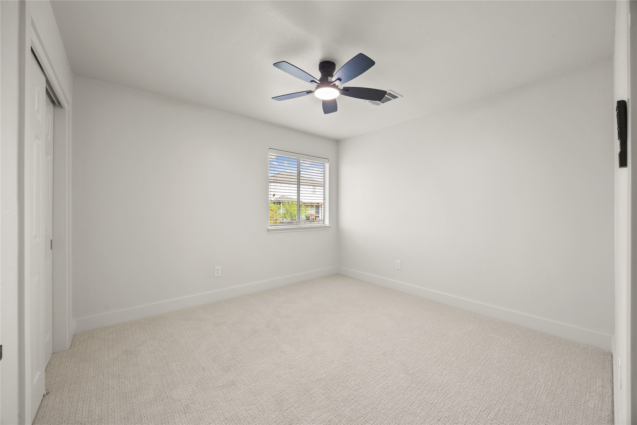 117 Waterloo Drive Kyle, TX 78640 - Photo 22 of 39 an empty room with window and windows