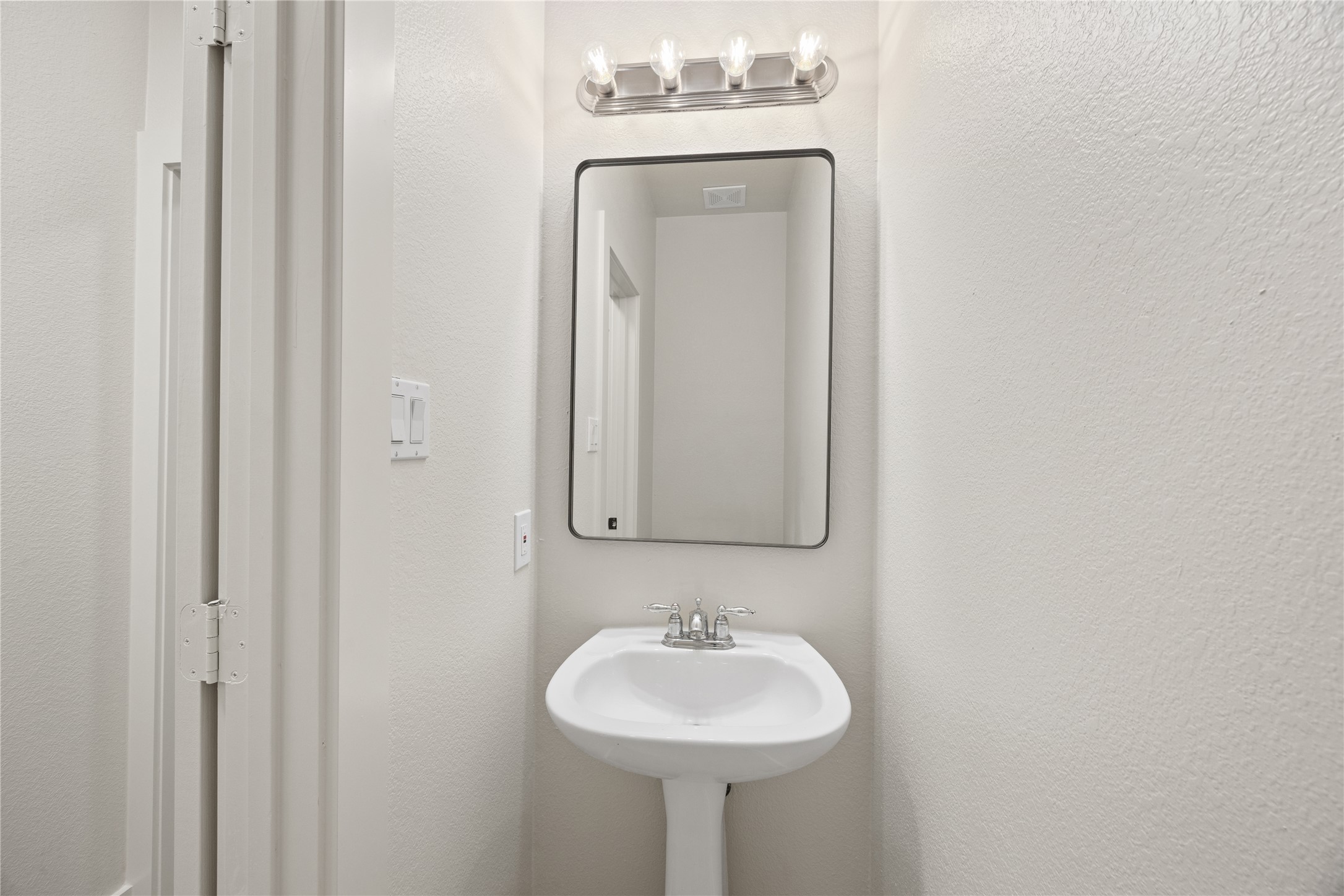 117 Waterloo Drive Kyle, TX 78640 - Photo 24 of 39 a bathroom with a sink and a mirror