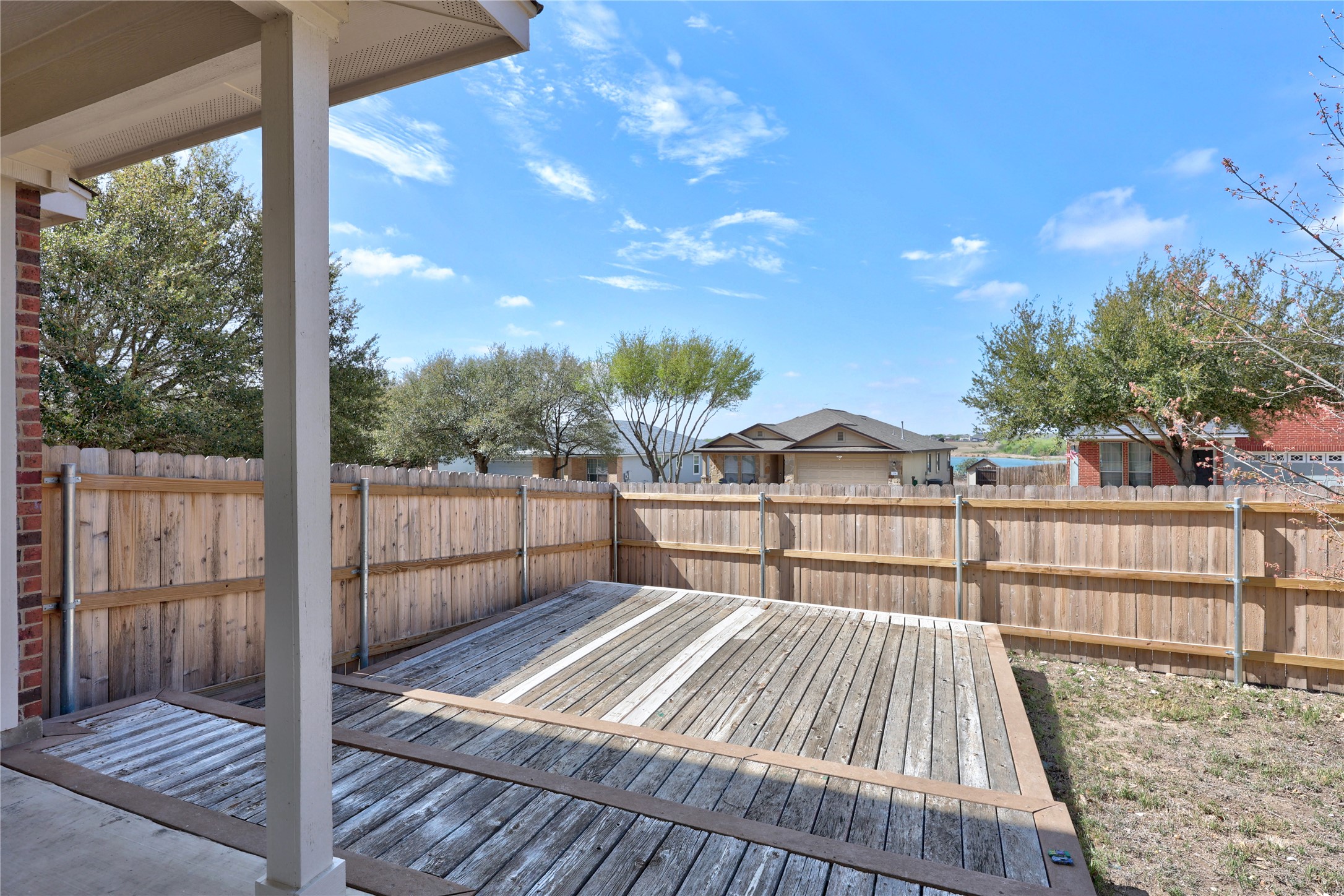 117 Waterloo Drive Kyle, TX 78640 - Photo 29 of 39 a view of a balcony with wooden floor and fence