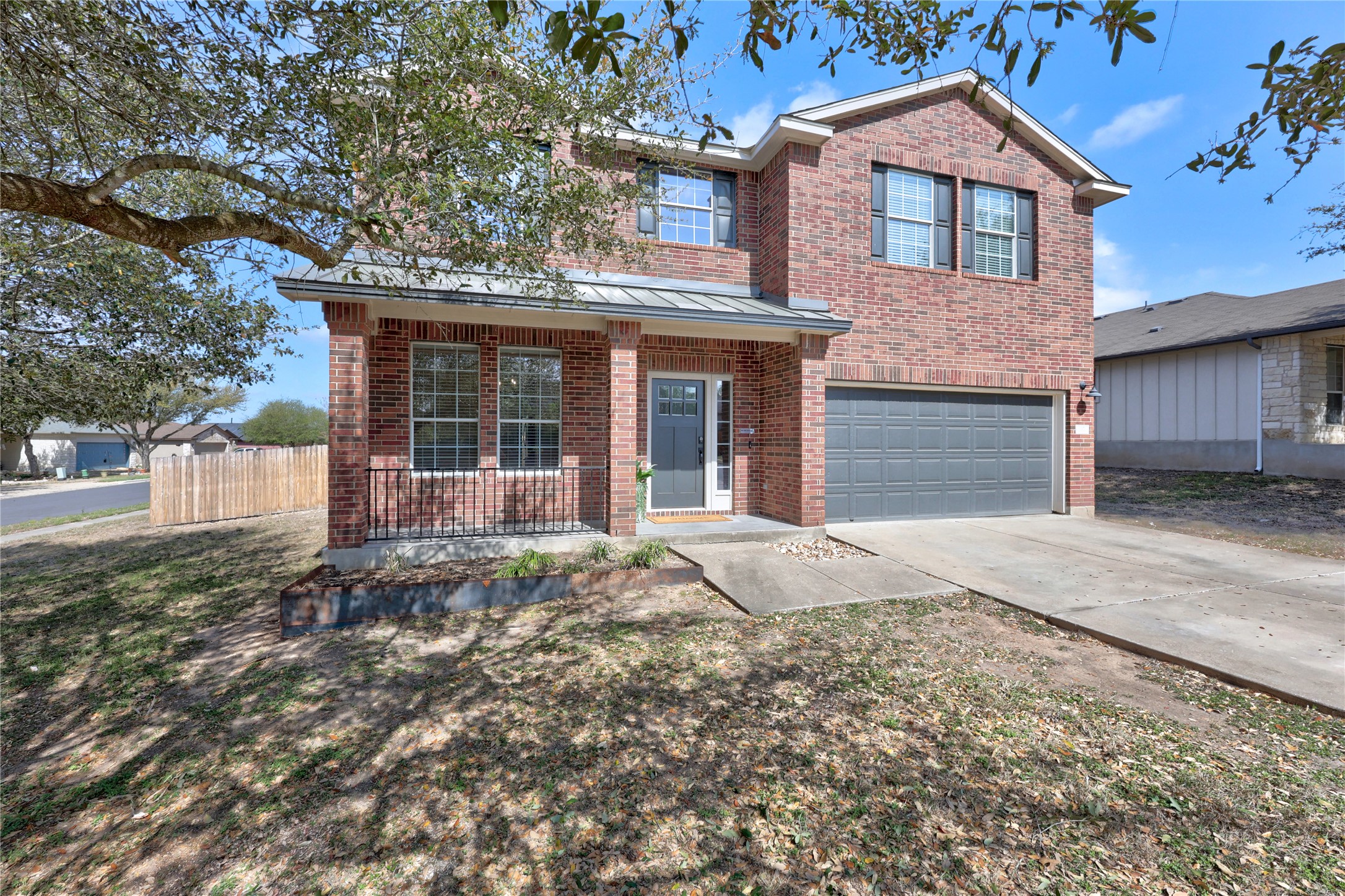 117 Waterloo Drive Kyle, TX 78640 - Photo 38 of 39 a house view with a garden space