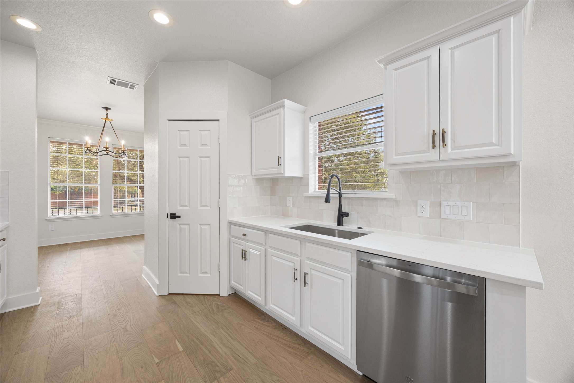 117 Waterloo Drive Kyle, TX 78640 - Photo 6 of 39 a kitchen with stainless steel appliances granite countertop a sink a stove and a refrigerator