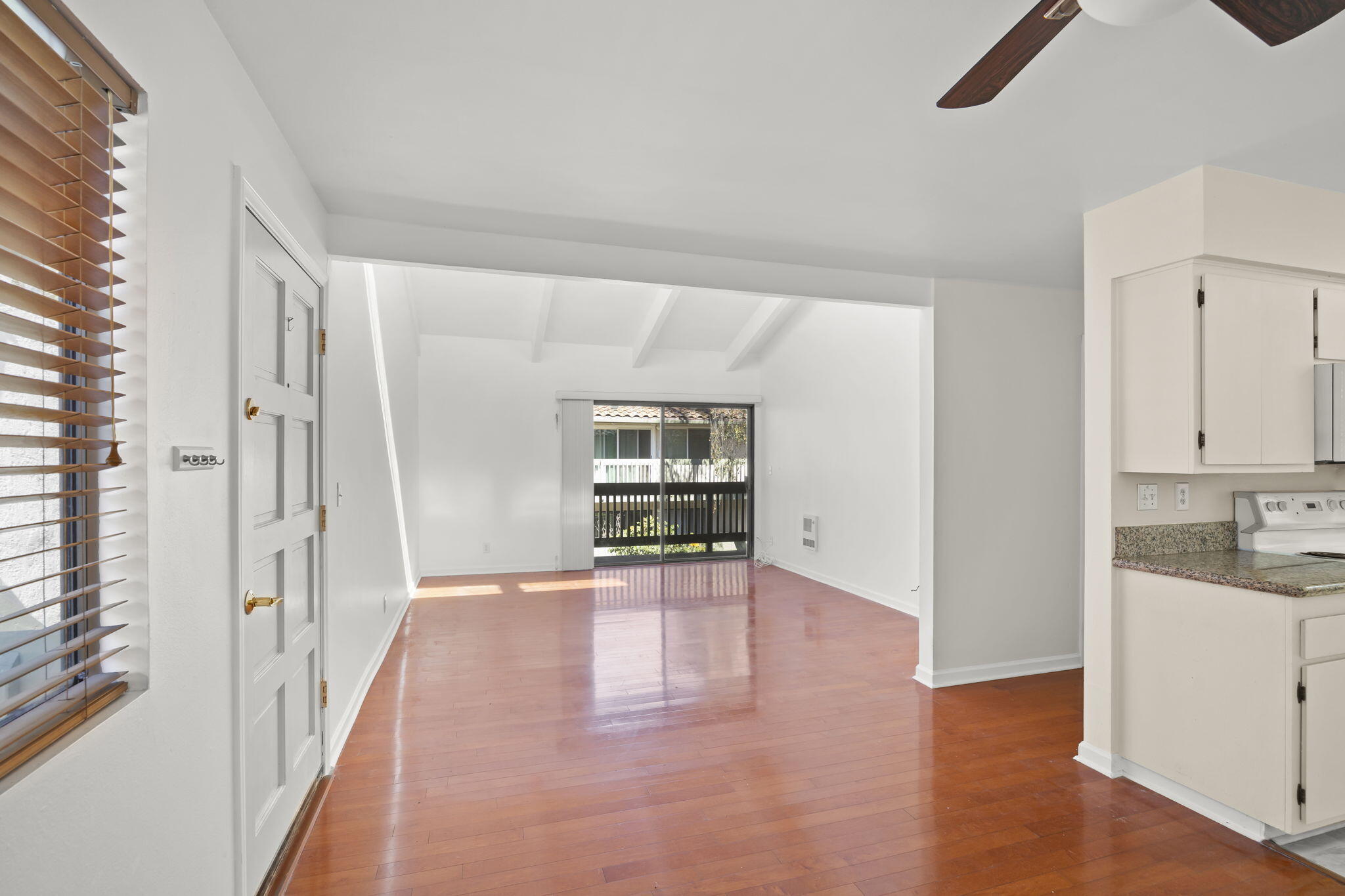 35 Dearborn Place, Unit 56 Goleta, CA 93117 - Photo 7 of 21 an empty room with wooden floor and windows