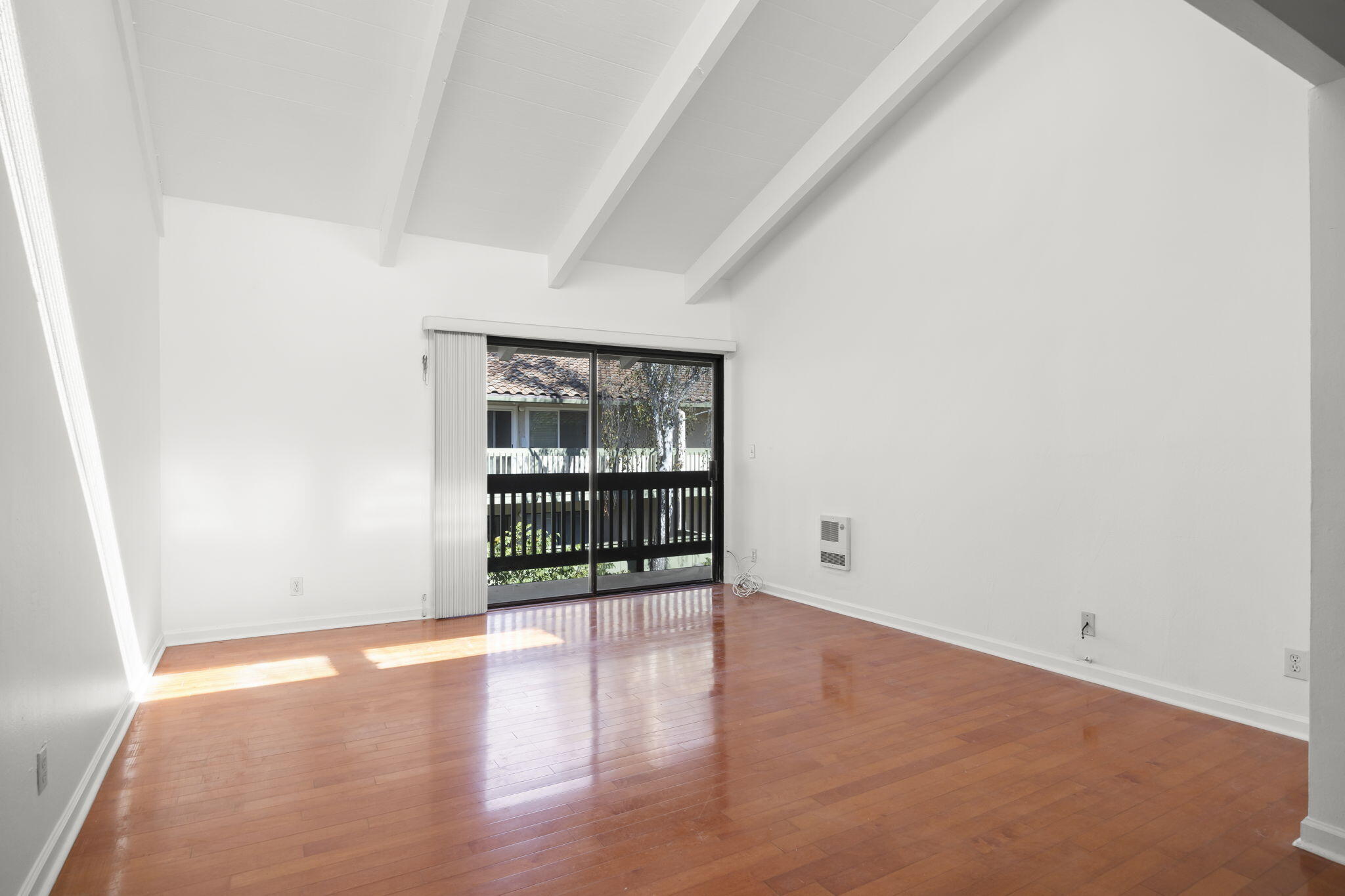 35 Dearborn Place, Unit 56 Goleta, CA 93117 - Photo 8 of 21 an empty room with wooden floor and windows