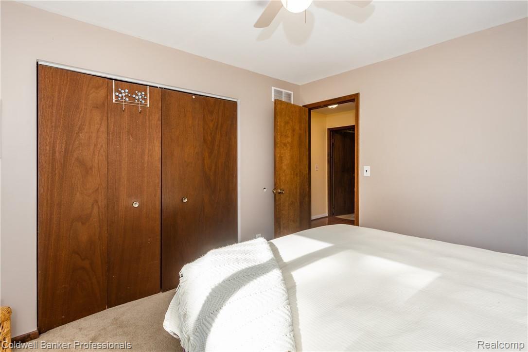 4777 Six Mile Road South Lyon, MI 48178 - Photo 45 of 71 Bedroom 3 closet extends to the left for additional storage