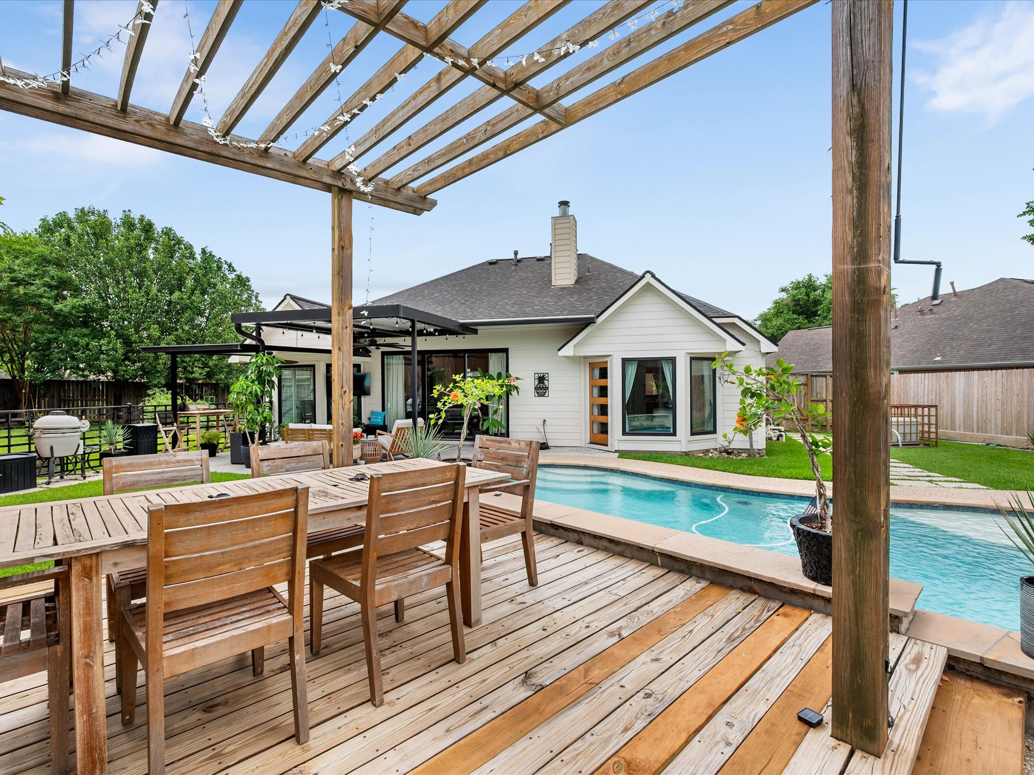 4023 Tigris Ridge Drive Katy, TX 77449 - Photo 35 of 39 A metal pergola (2021–2022) adds both style and function, creating a defined outdoor lounge area.