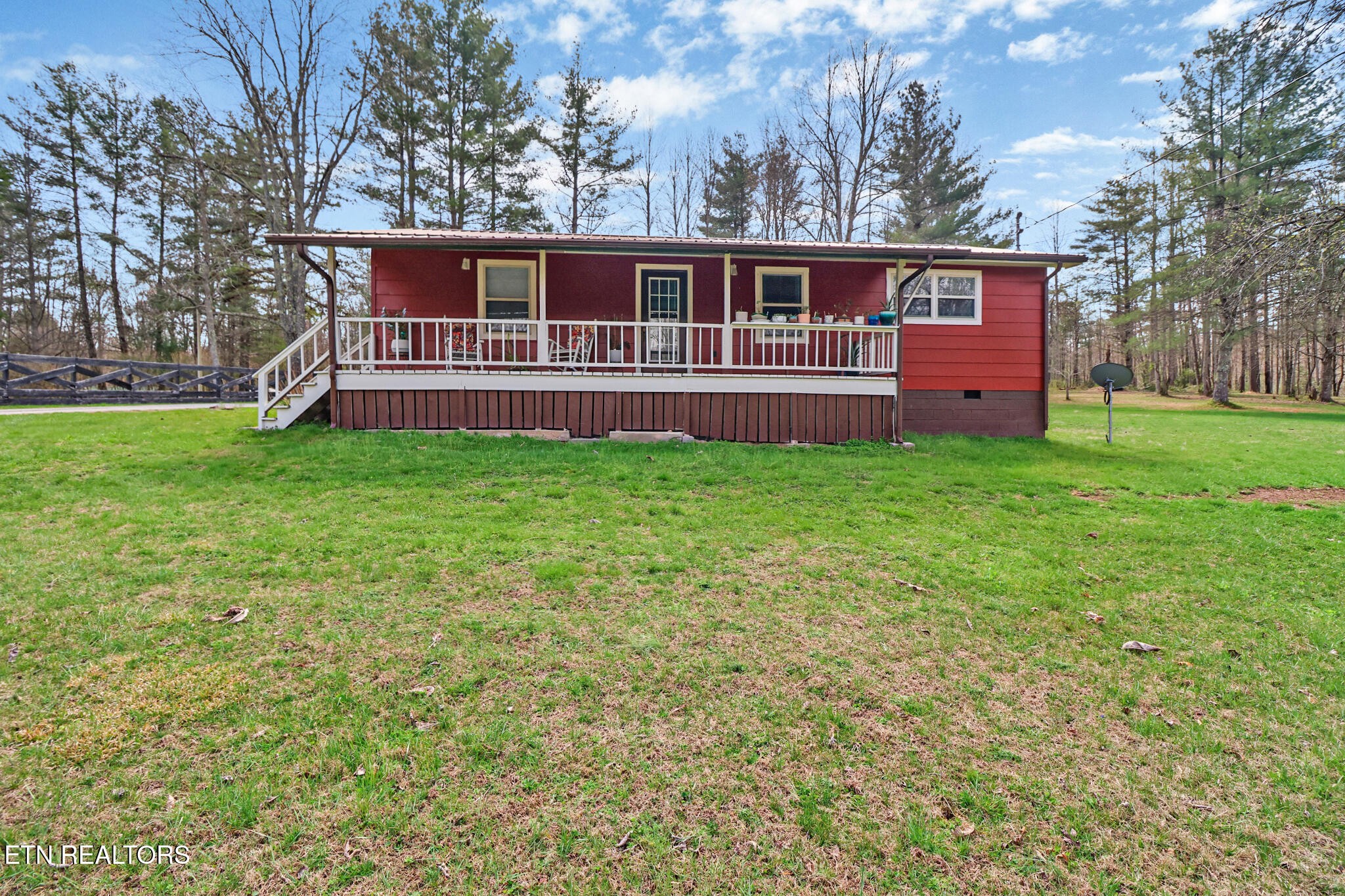 239 Doc Huling Road Robbins, TN 37852 - Photo 2 of 55 a view of backyard with deck and garden