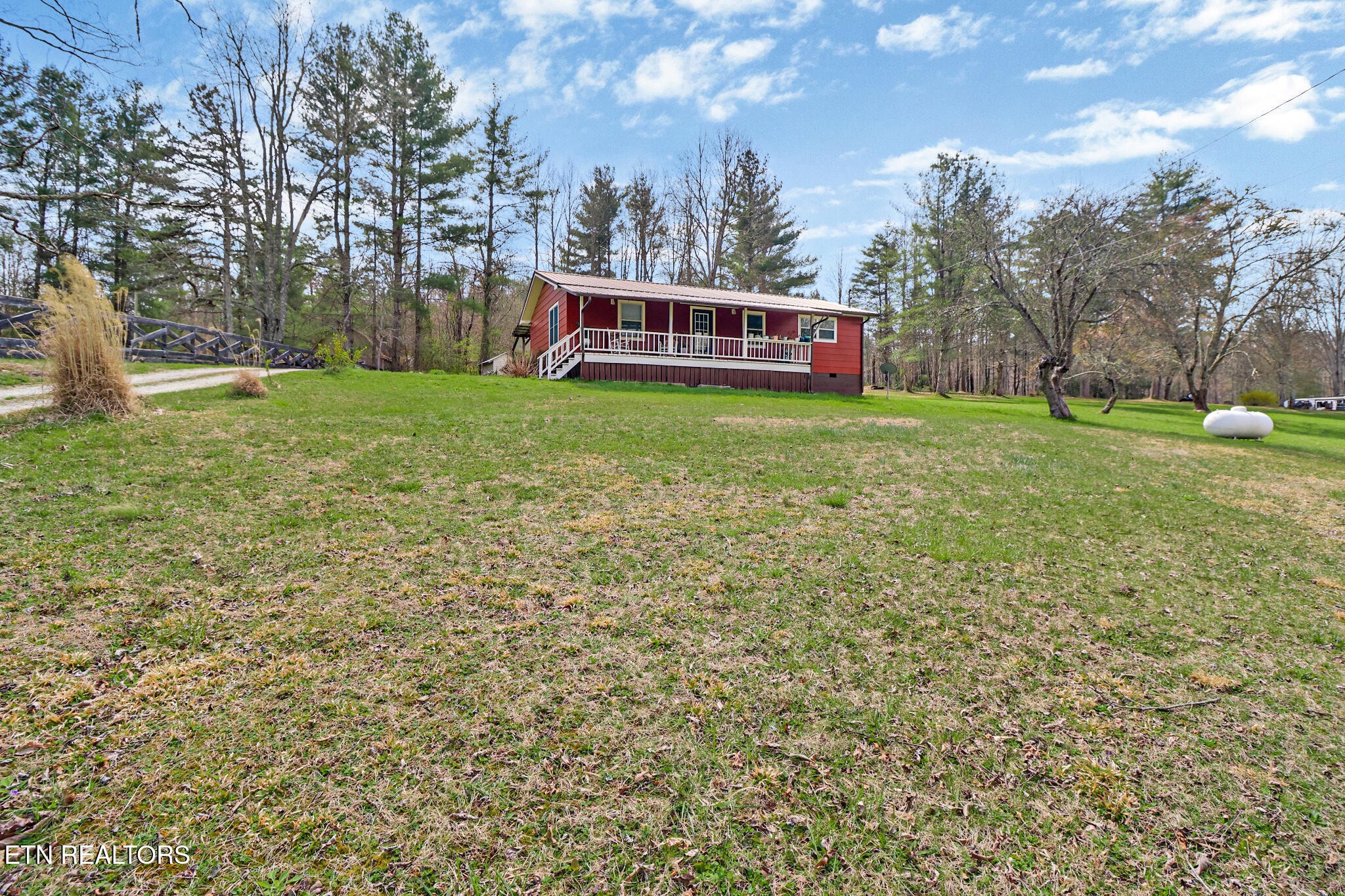 239 Doc Huling Road Robbins, TN 37852 - Photo 27 of 55 a view of a house with a yard