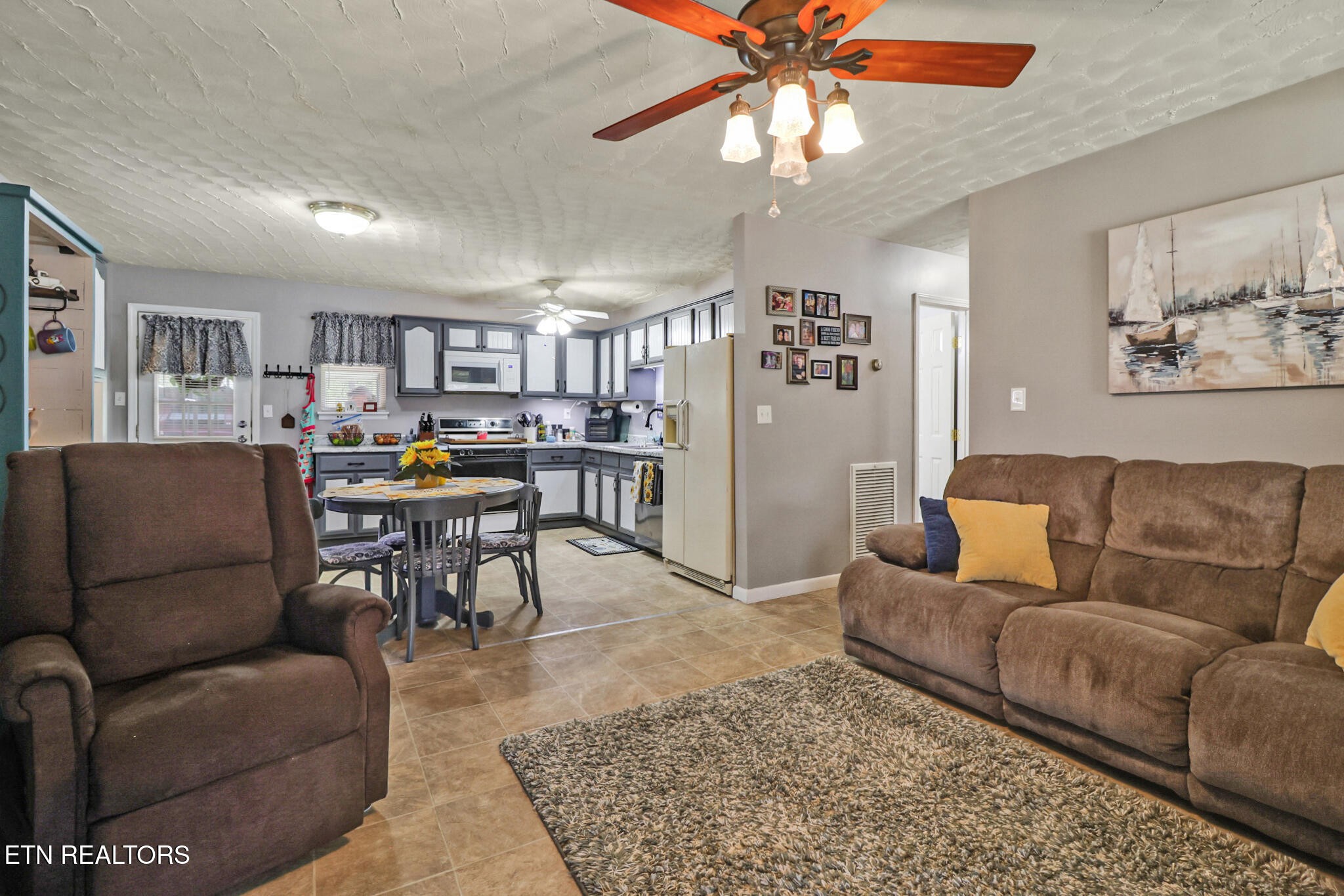 239 Doc Huling Road Robbins, TN 37852 - Photo 30 of 55 a living room with furniture and a rug