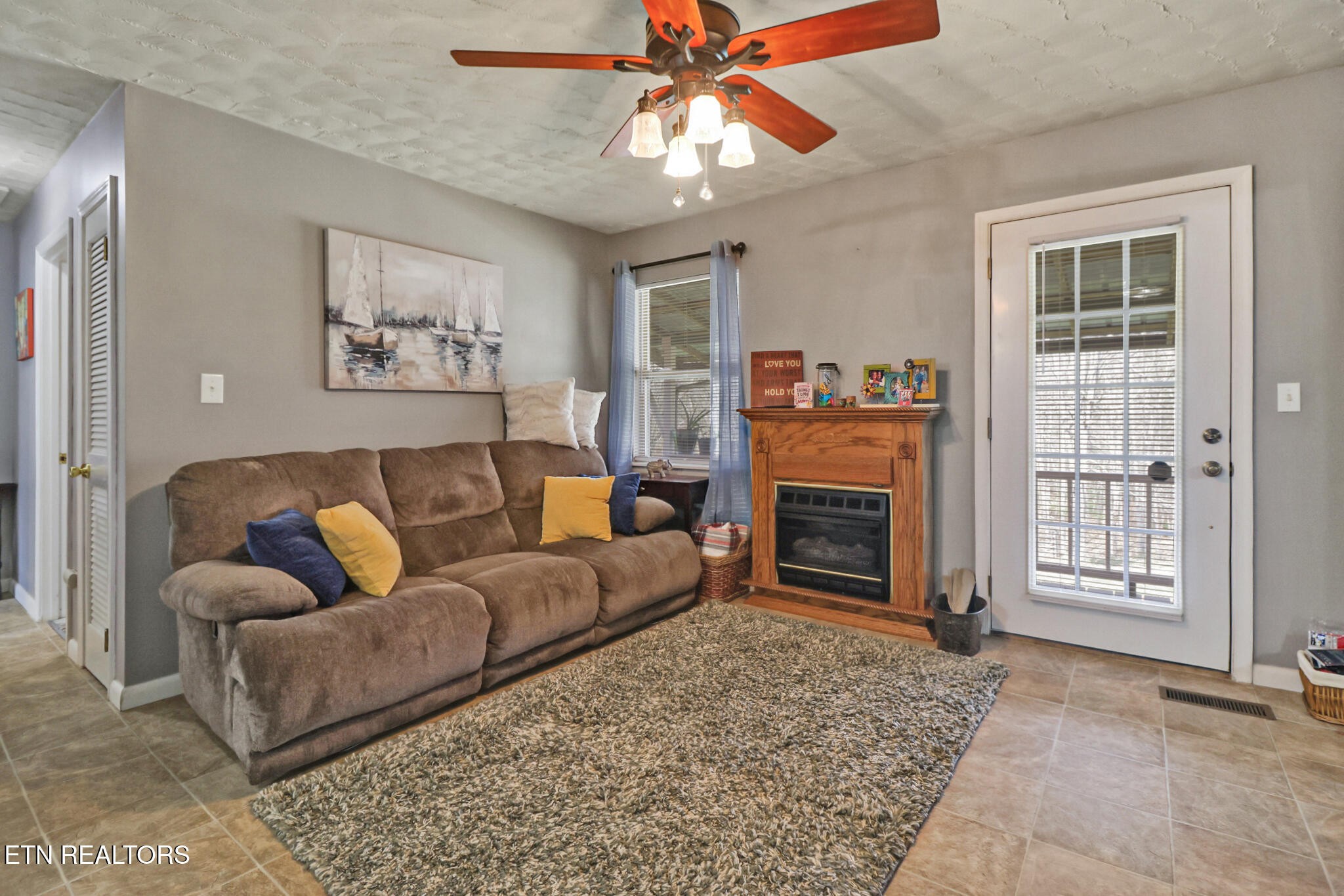 239 Doc Huling Road Robbins, TN 37852 - Photo 33 of 55 a living room with furniture a fireplace and a window