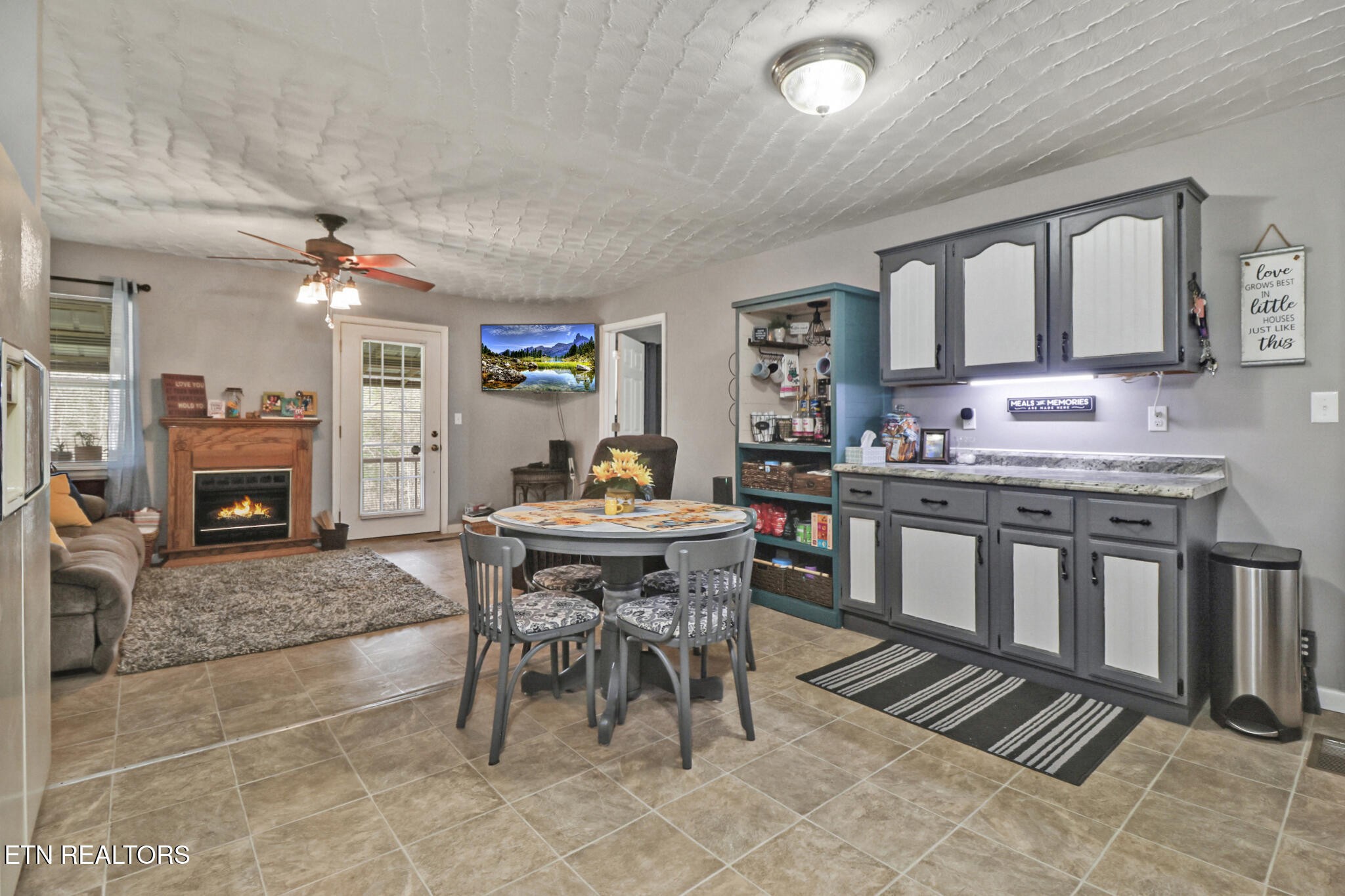 239 Doc Huling Road Robbins, TN 37852 - Photo 40 of 55 a living room with furniture a fireplace and a table