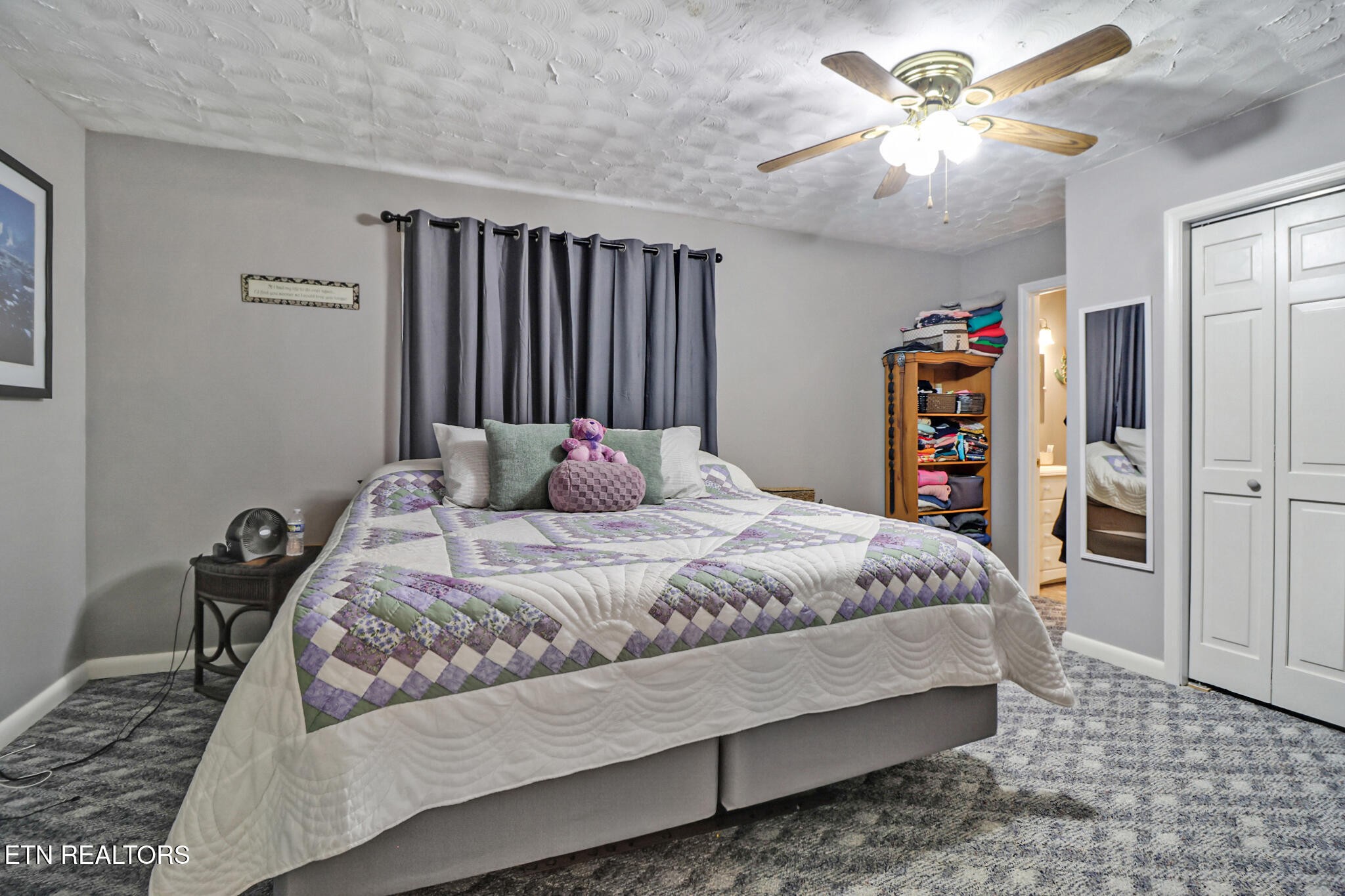 239 Doc Huling Road Robbins, TN 37852 - Photo 42 of 55 a bedroom with a bed dresser and a chandelier