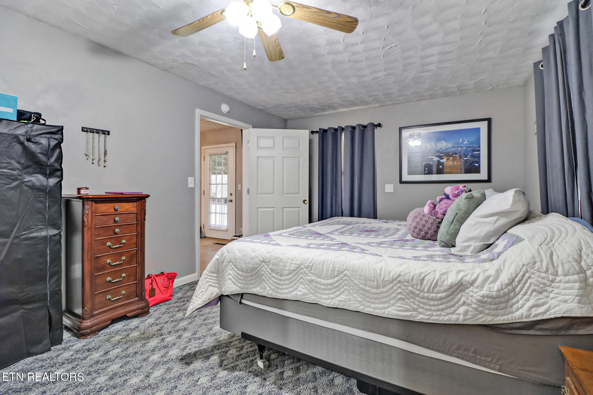 239 Doc Huling Road Robbins, TN 37852 - Photo 43 of 55 a bedroom with a bed and a chandelier