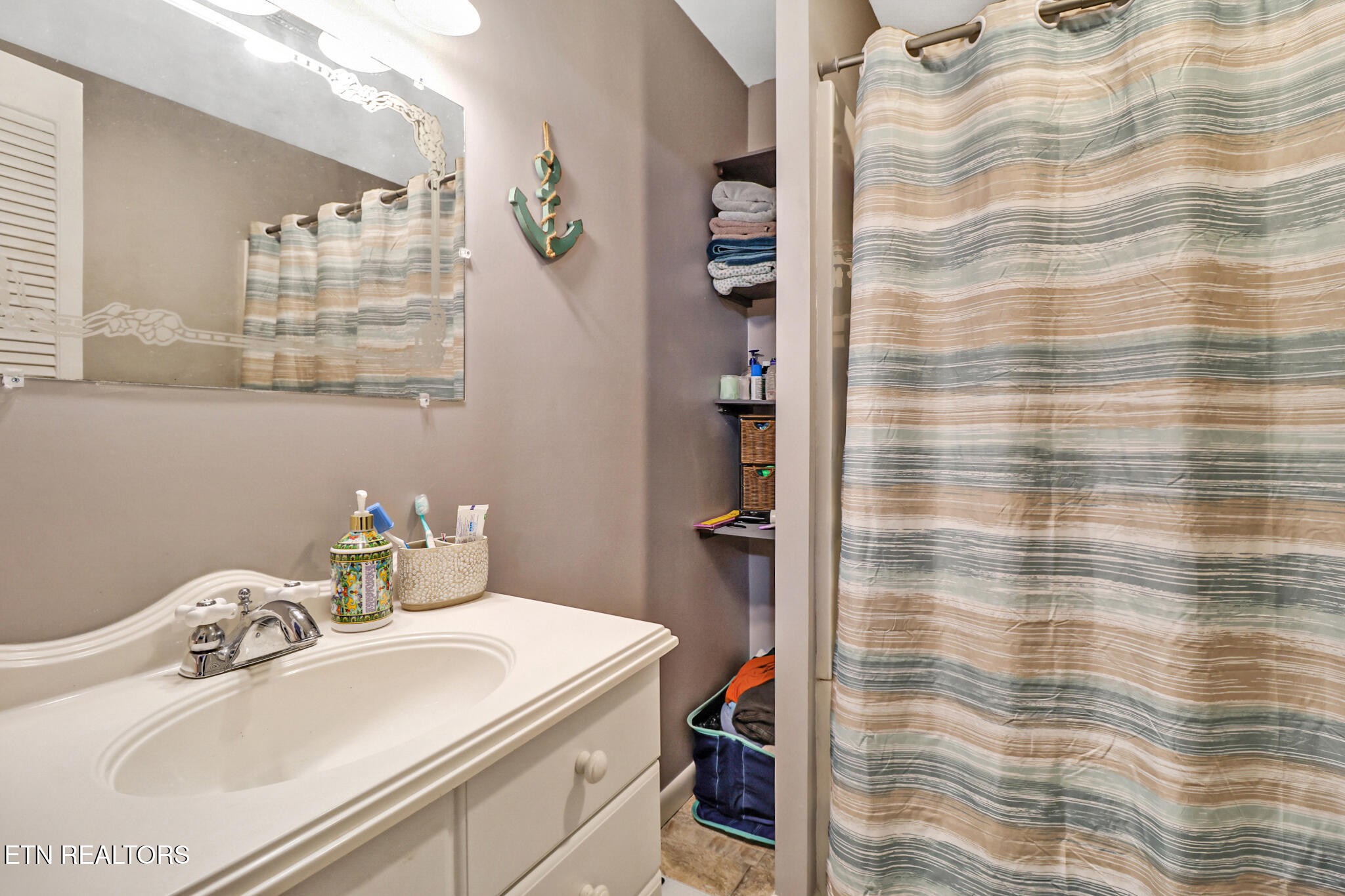 239 Doc Huling Road Robbins, TN 37852 - Photo 44 of 55 a bathroom with a sink and a mirror