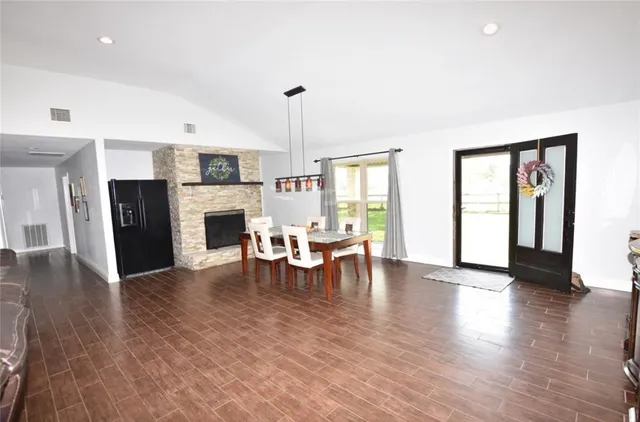 a view of a livingroom with furniture window and wooden floor