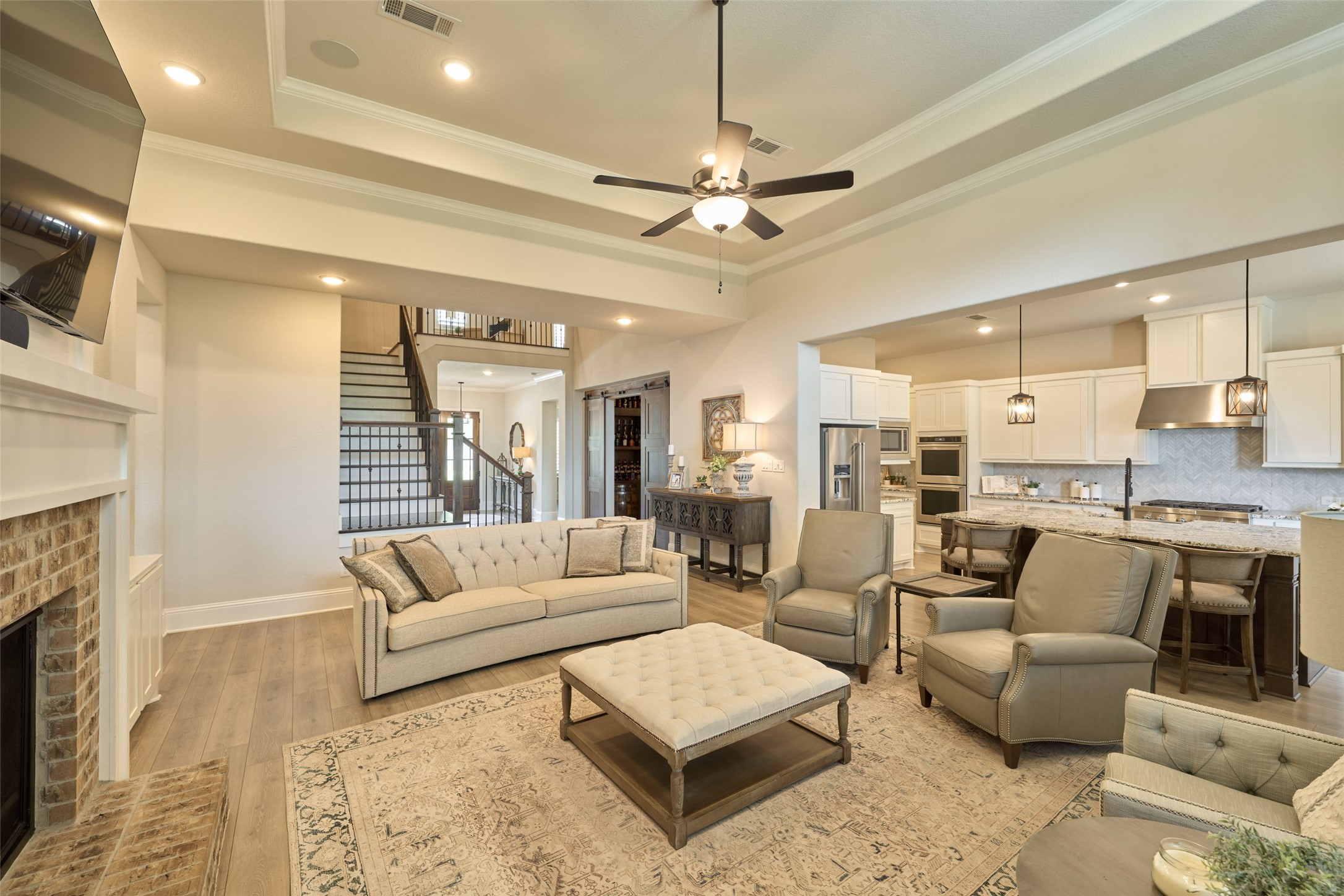 10090 South Goshawk Trail Conroe, TX 77385 - Photo 14 of 43 Spacious family room with open plan kitchen and breakfast room.