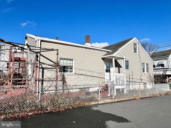 a view of a house with a street