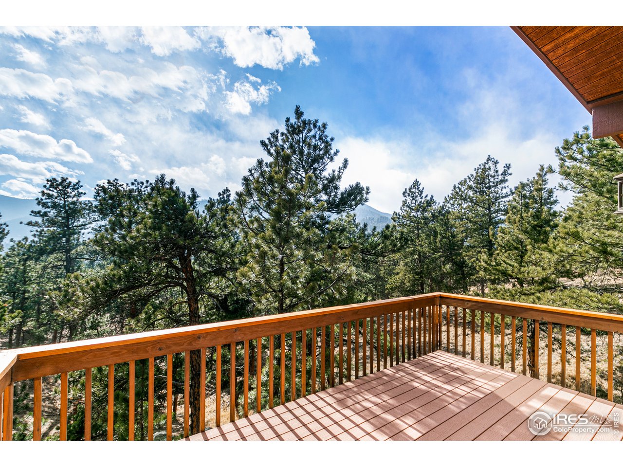 239 Broken Fence Road Boulder, CO 80302 - Photo 26 of 40 a view of balcony with wooden floor and fence