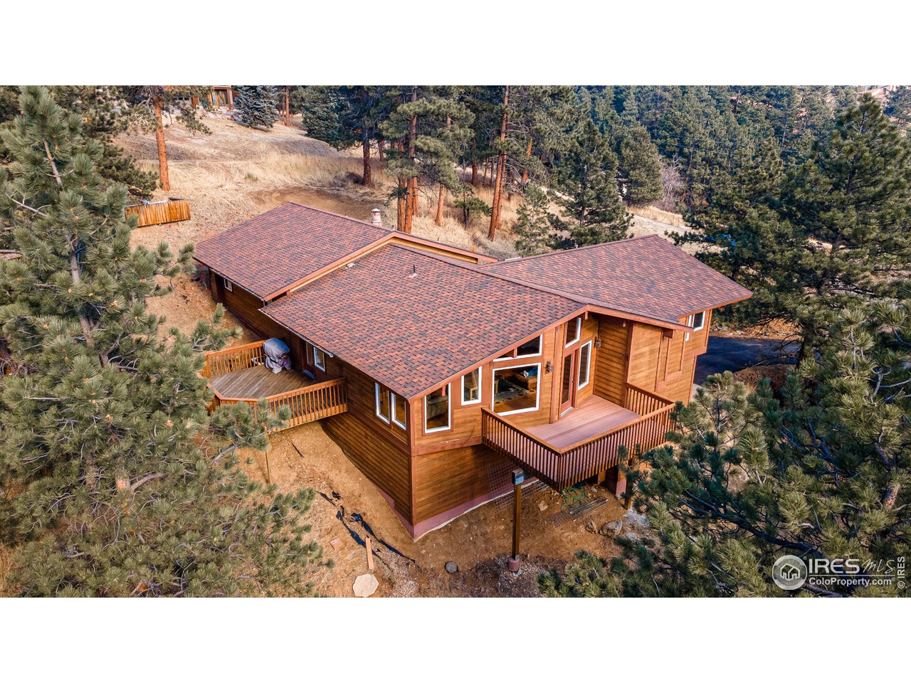 239 Broken Fence Road Boulder, CO 80302 - Photo 34 of 40 a aerial view of a house with a backyard