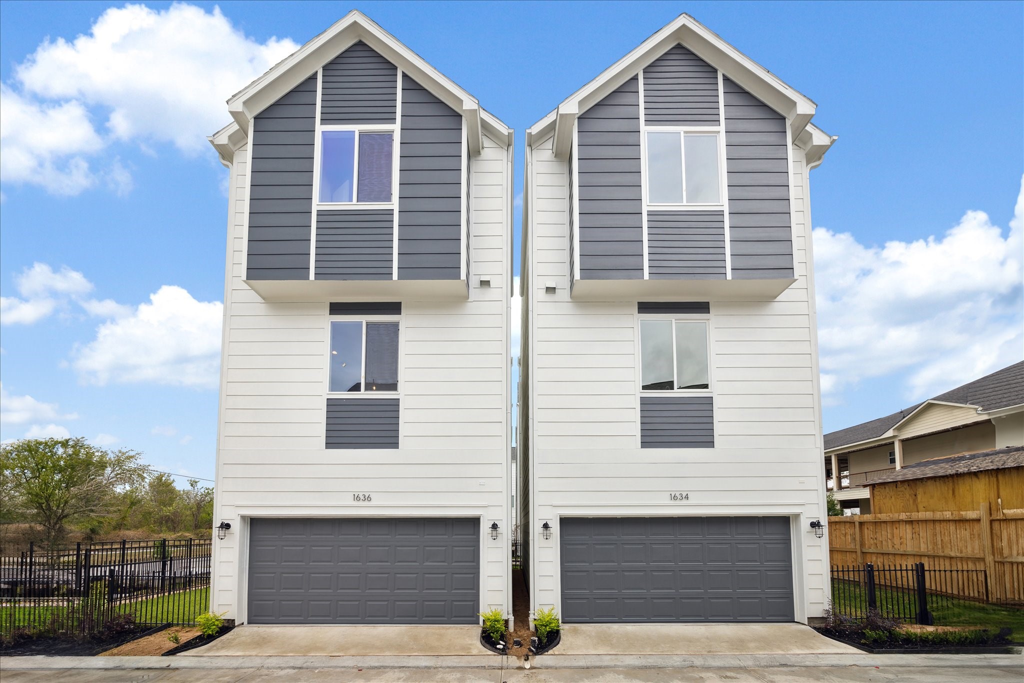 a front view of a house with garage