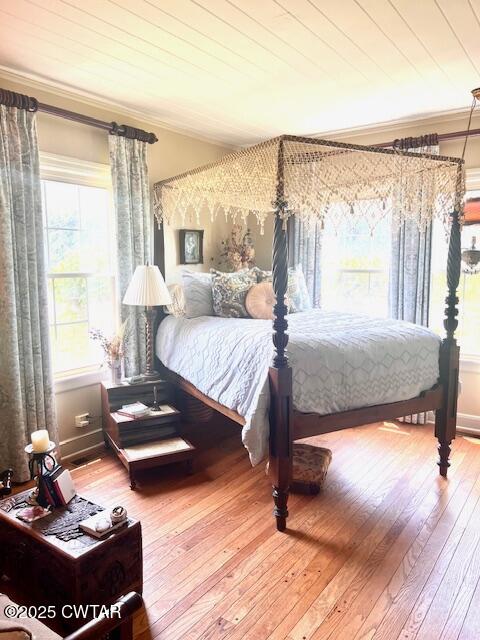 641 Headden Drive Ridgely, TN 38080 - Photo 11 of 21 a bedroom with a bed and wooden floor