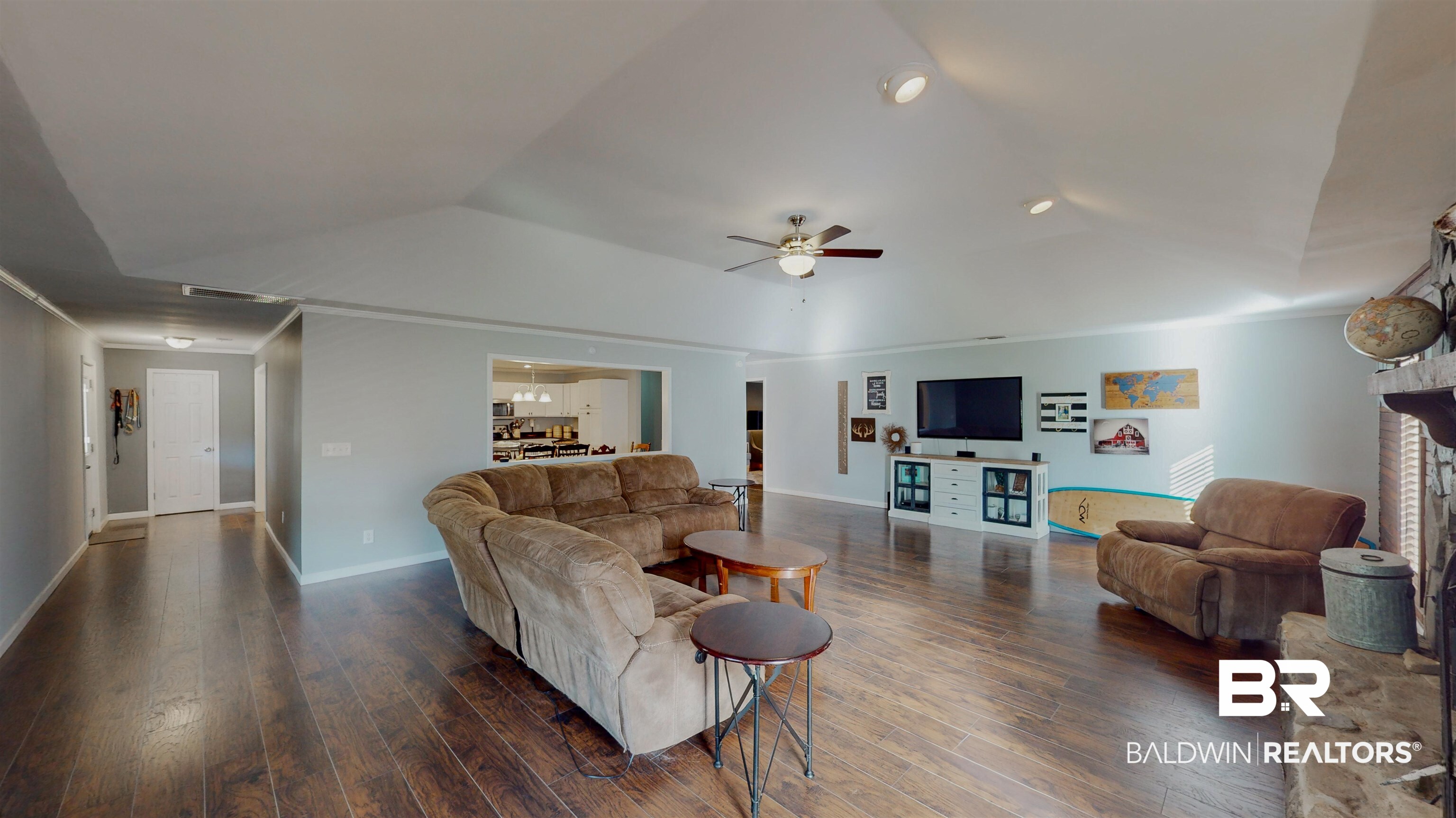 19365 Keller Road Foley, AL 36535 - Photo 14 of 41 Living room with ceiling fan, dark wood-type flooring, and vaulted ceiling