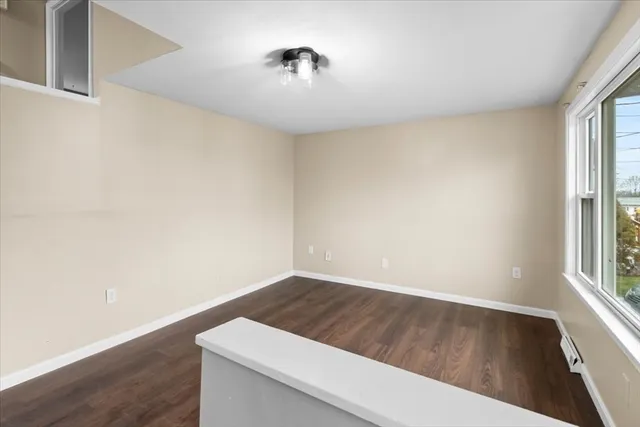 a view of wooden floor and cabinet in a room