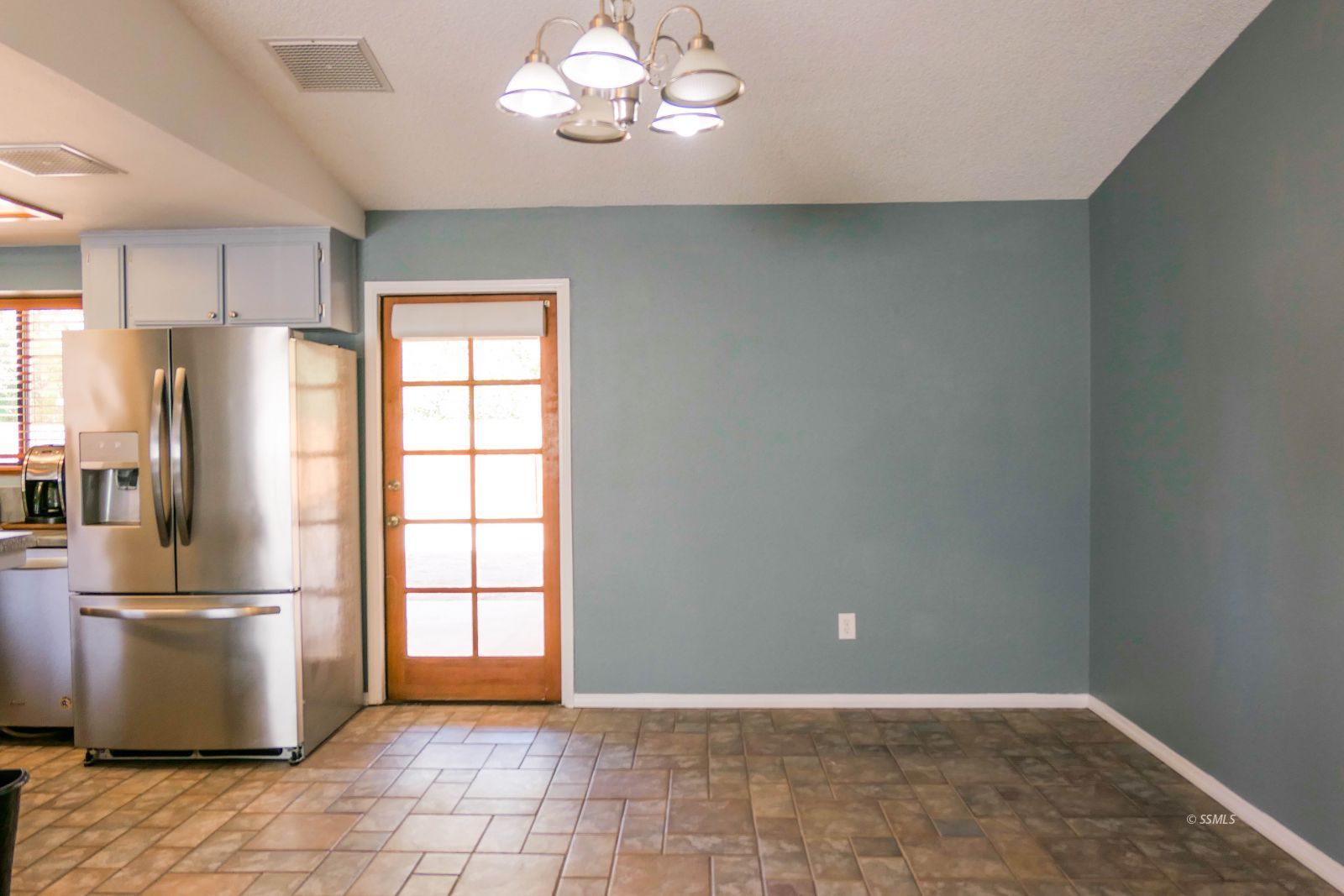 601 Heather Court Ridgecrest, CA 93555 - Photo 20 of 45 a view of a kitchen with a refrigerator and windows